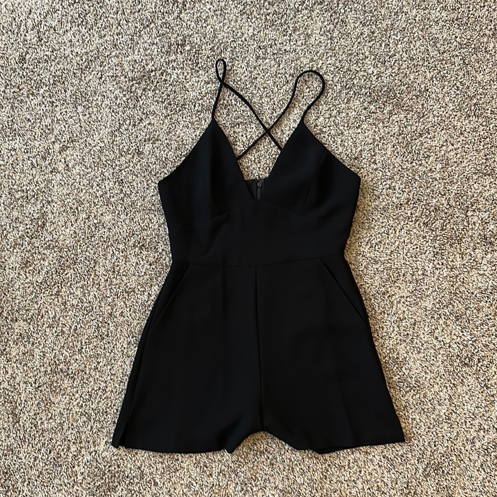 Simple black romper with adjustable spaghetti straps. BCBG. Worn once!